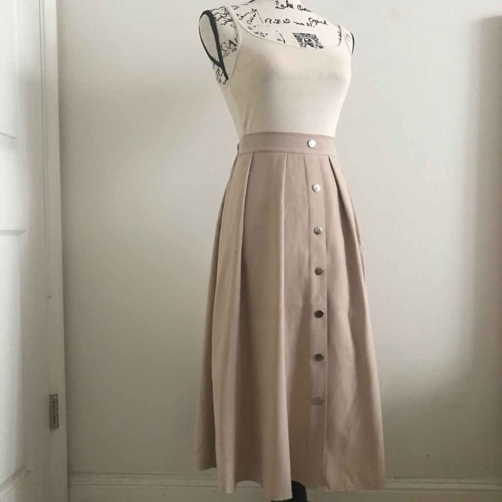 The pleated button down high waisted skirt